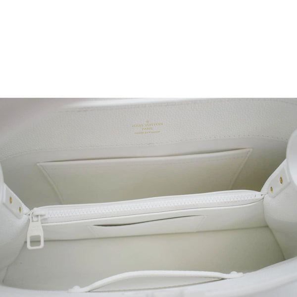 LOUIS VUITTON White leather bucket bag with gold drawstring closure 