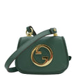 Green Gucci purse with gold GG logo