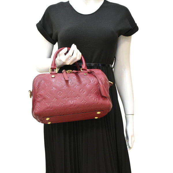 LOUIS VUITTON Speedy 25 Bandouliere Monogram Empreinte Crossbody Bag Fuchsia