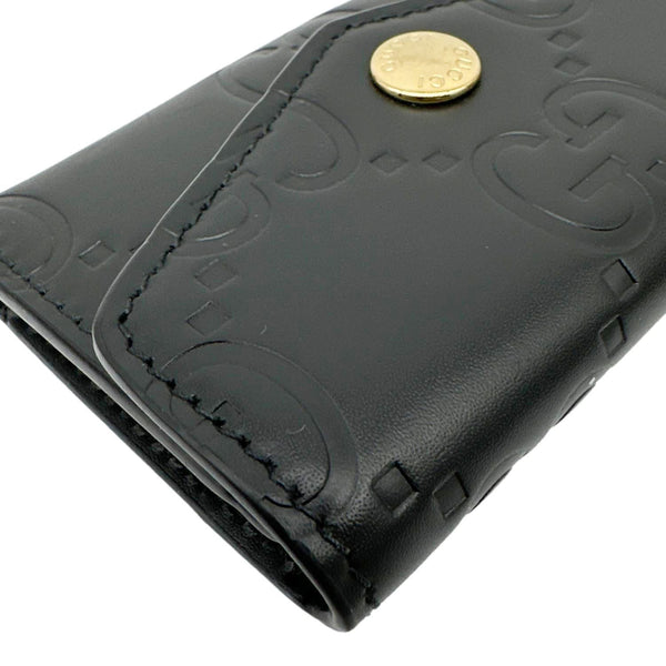 GUCCI Snap Gilbert Jumbo GG Calfskin Embossed Leather Wallet Black 772792