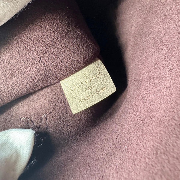 LOUIS VUITTON Neverfull Pochette Giant Monogram Empreinte Leather Wristlet Beige