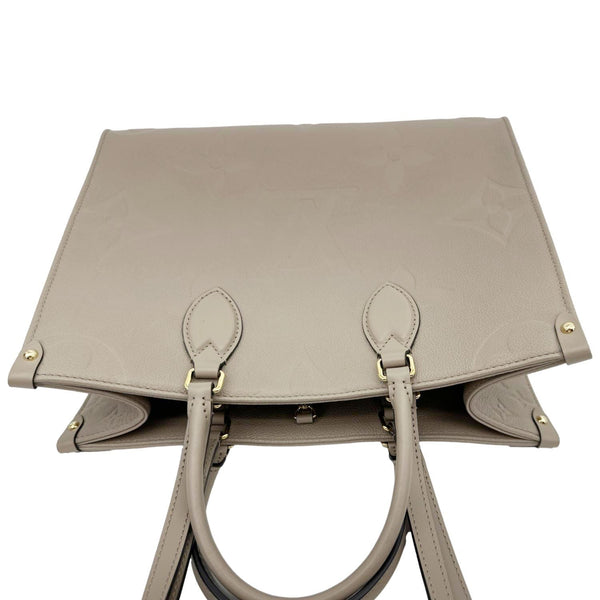 LOUIS VUITTON Onthego MM Giant Monogram Empreinte Leather Tote Bag Beige