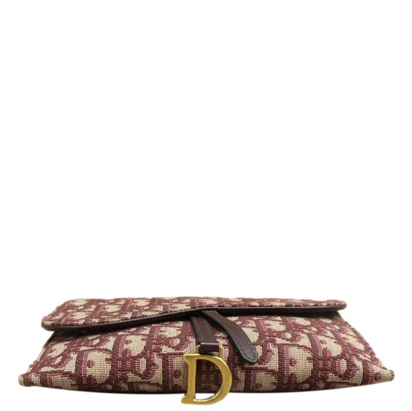 CHRISTIAN DIOR Burgundy canvas clutch with brown leather strap
