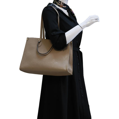 LOUIS VUITTON Onthego MM Giant Monogram Empreinte Leather Tote Bag Beige