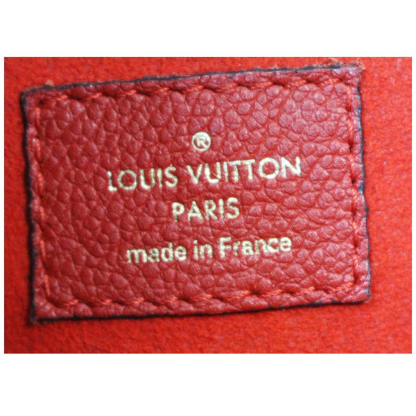 Louis Vuitton Pallas Chain Shopper Monogram bag tag.
