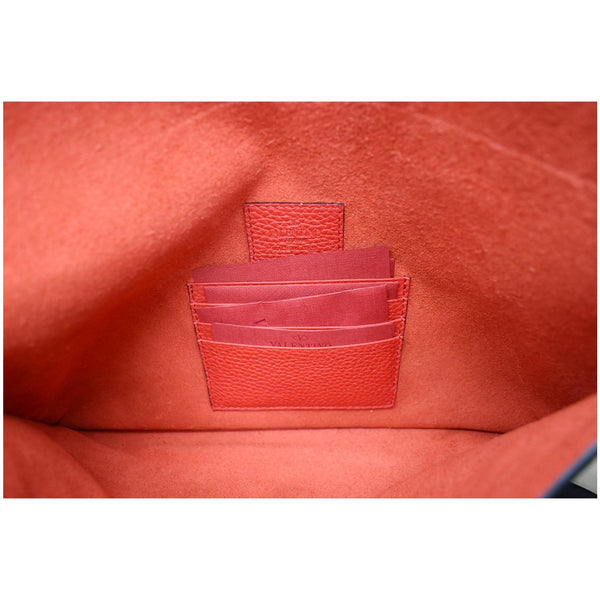 VALENTINO Garavani Rockstud Grainy Envelope Pouch Red