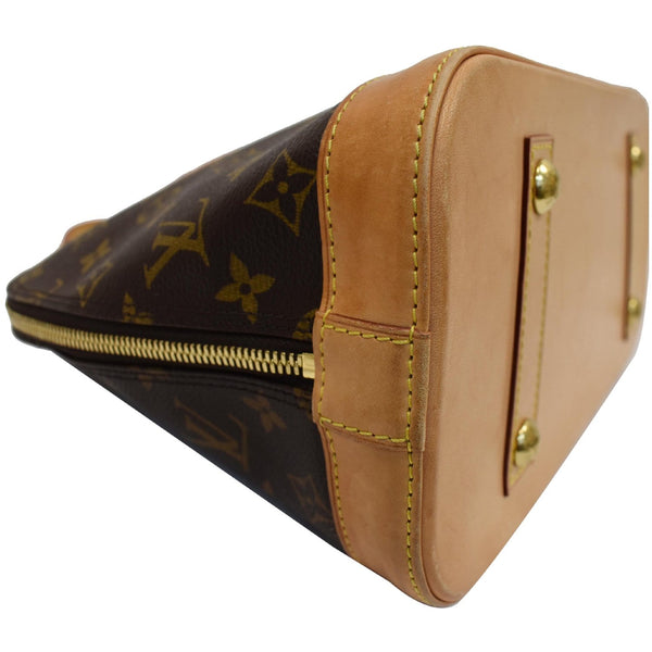 Louis Vuitton ﻿Alma Monogram Canvas Satchel Bag Brown - left side view