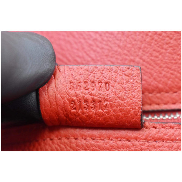 Gucci Jackie Large Top Handle Leather Bag serial code