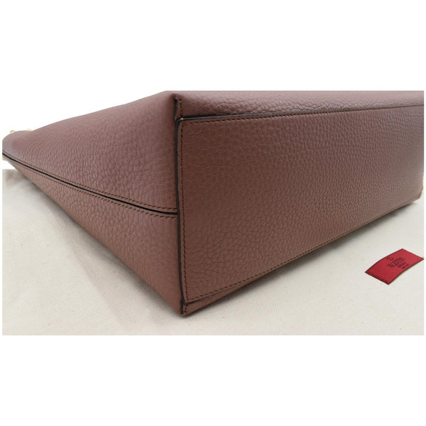 Valentino Garavani Rockstud Textured Leather Shopping Bag bottom corner