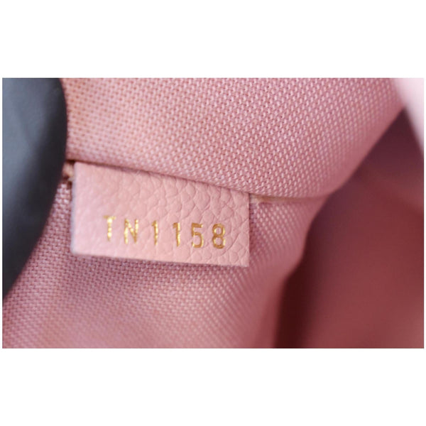 Louis Vuitton Daily Pouch Monogram Empreinte Leather - bag code tag