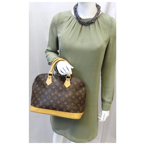 Louis Vuitton Alma Monogram Canvas Satchel Bag Brown for women