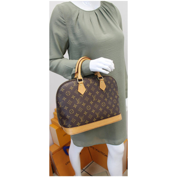 LOUIS VUITTON Alma Monogram Canvas Satchel Bag Brown