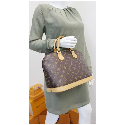 Louis Vuitton Alma Monogram Canvas Satchel Bag Brown for women 