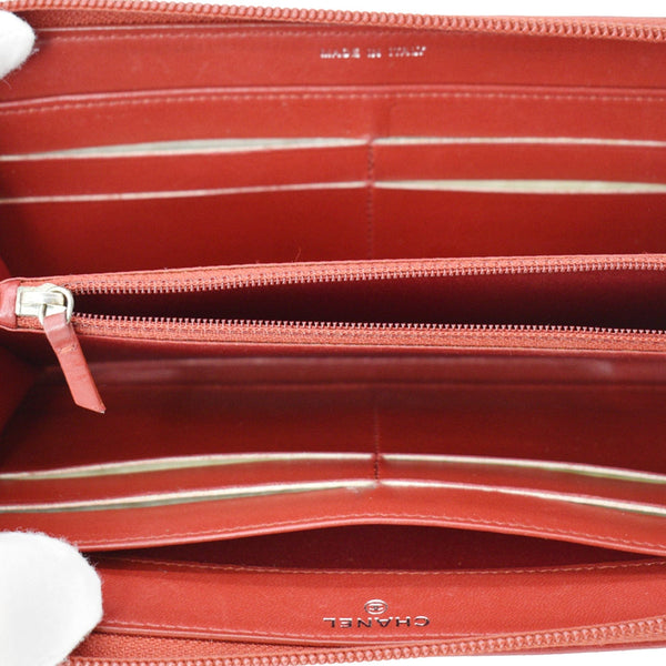 CHANEL Zippy Camellia Embossed Leather Wallet Red