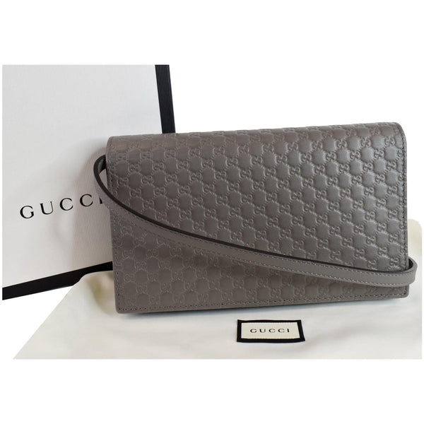 Gucci Micro Guccissima Leather Crossbody Wallet front look