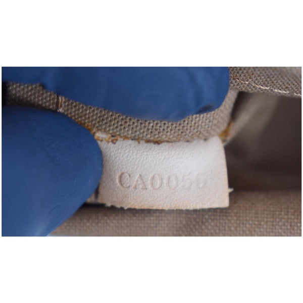 Louis Vuitton Tulum GM Monogram Canvas Shoulder Bag code tag