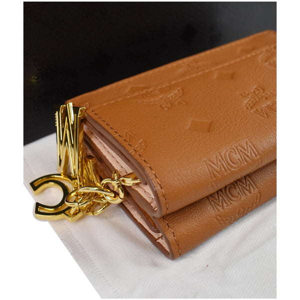MCM Klara Trifold Mini Monogram Leather Charm Wallet Cognac