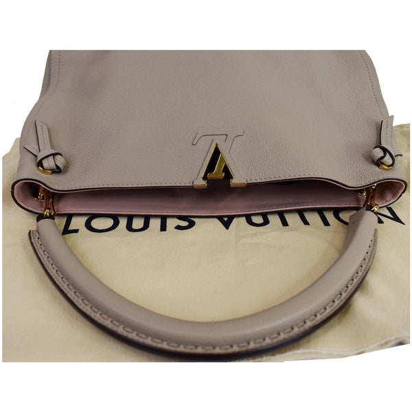 Louis Vuitton Tournon Taurillon Leather Hobo Bag Galet - round top handle