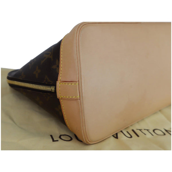 Louis Vuitton﻿ Alma Monogram Canvas Satchel Handbag left side view