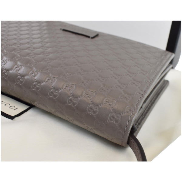 Gucci Micro Guccissima Leather Crossbody wallet close view