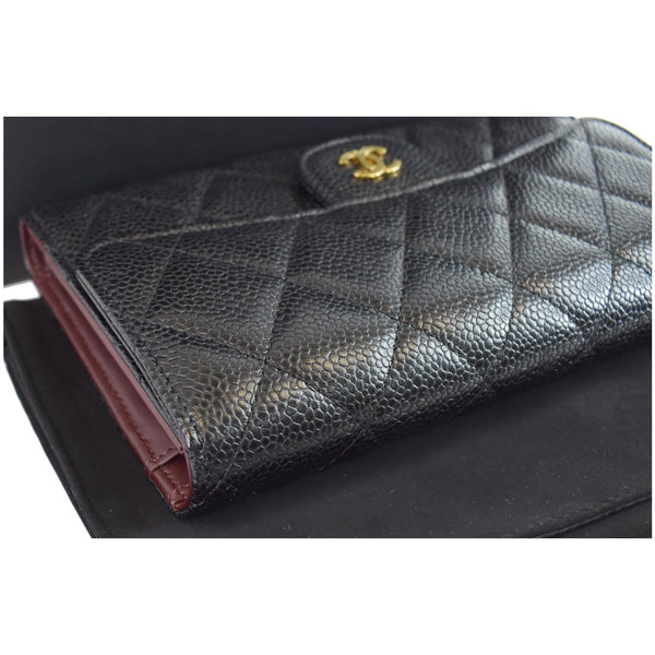 Chanel Large Flap Quilted Caviar Leather Wallet logo on front