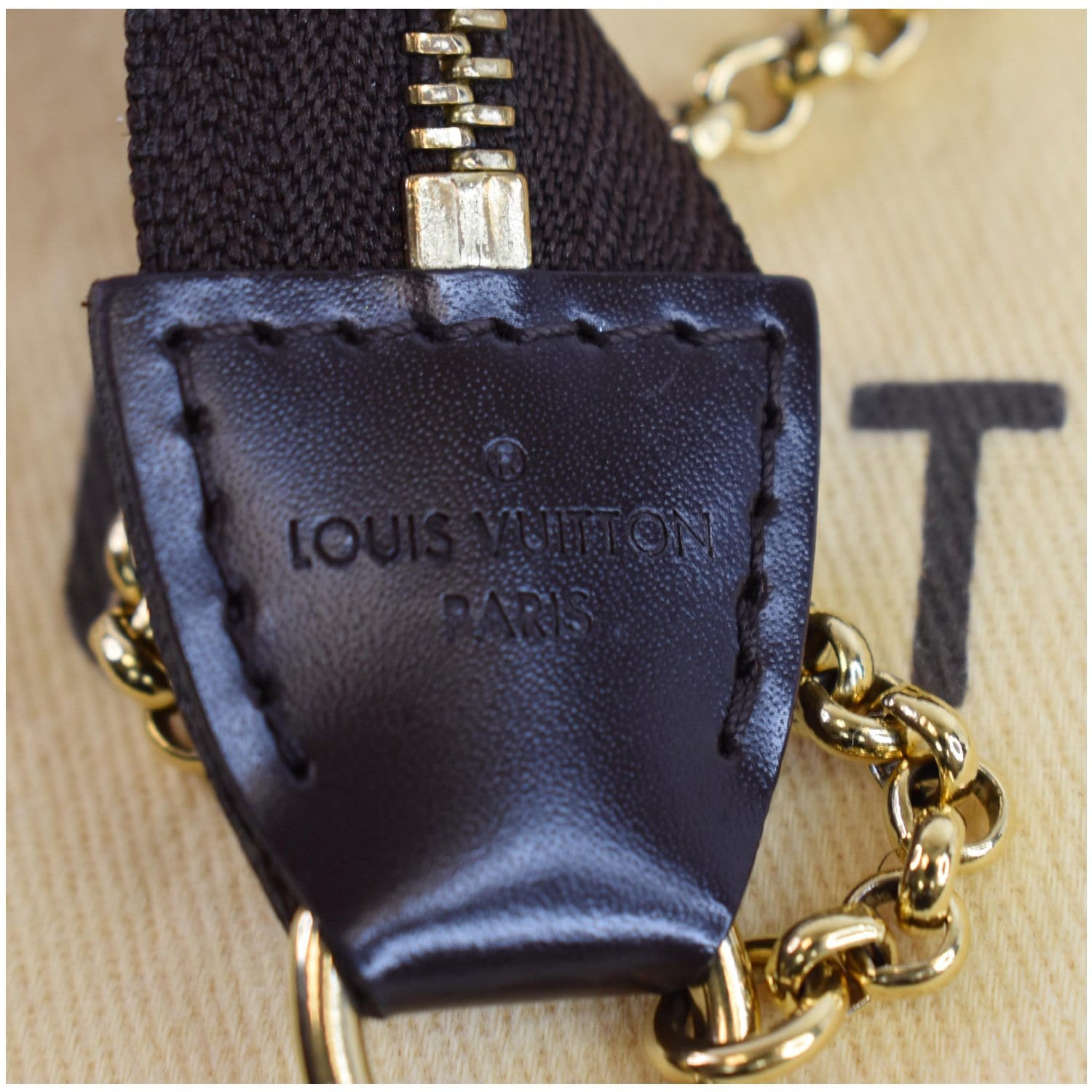 Louis Vuitton's Eva Damier Ebene Crossbody Clutch With Chain