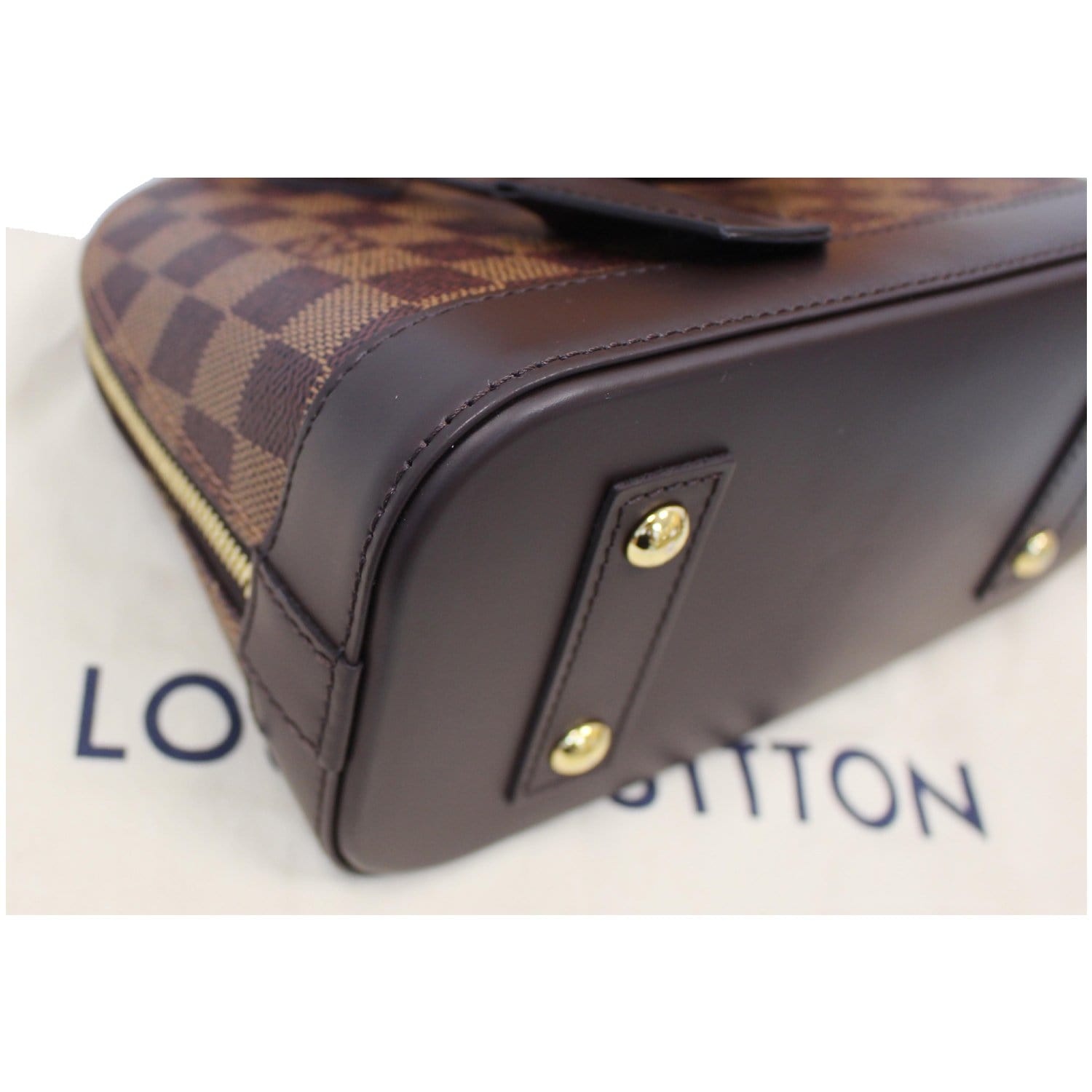 Louis Vuitton, Alma Damier Ebene Canvas Bag, brown plaid…