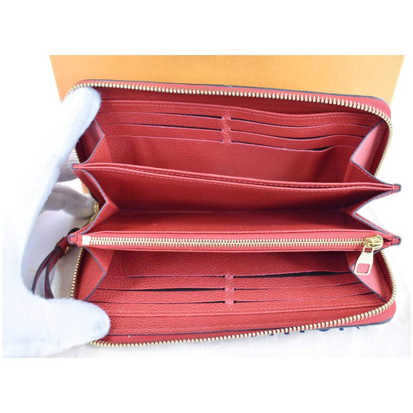 LOUIS VUITTON Monogram Empreinte Leather Zippy Wallet Red