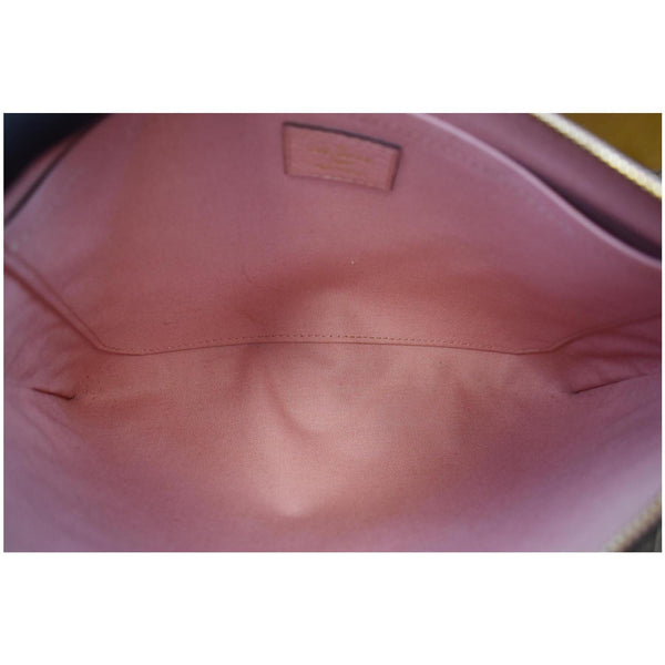Louis Vuitton Daily Pouch Monogram Empreinte Leather - pink interior