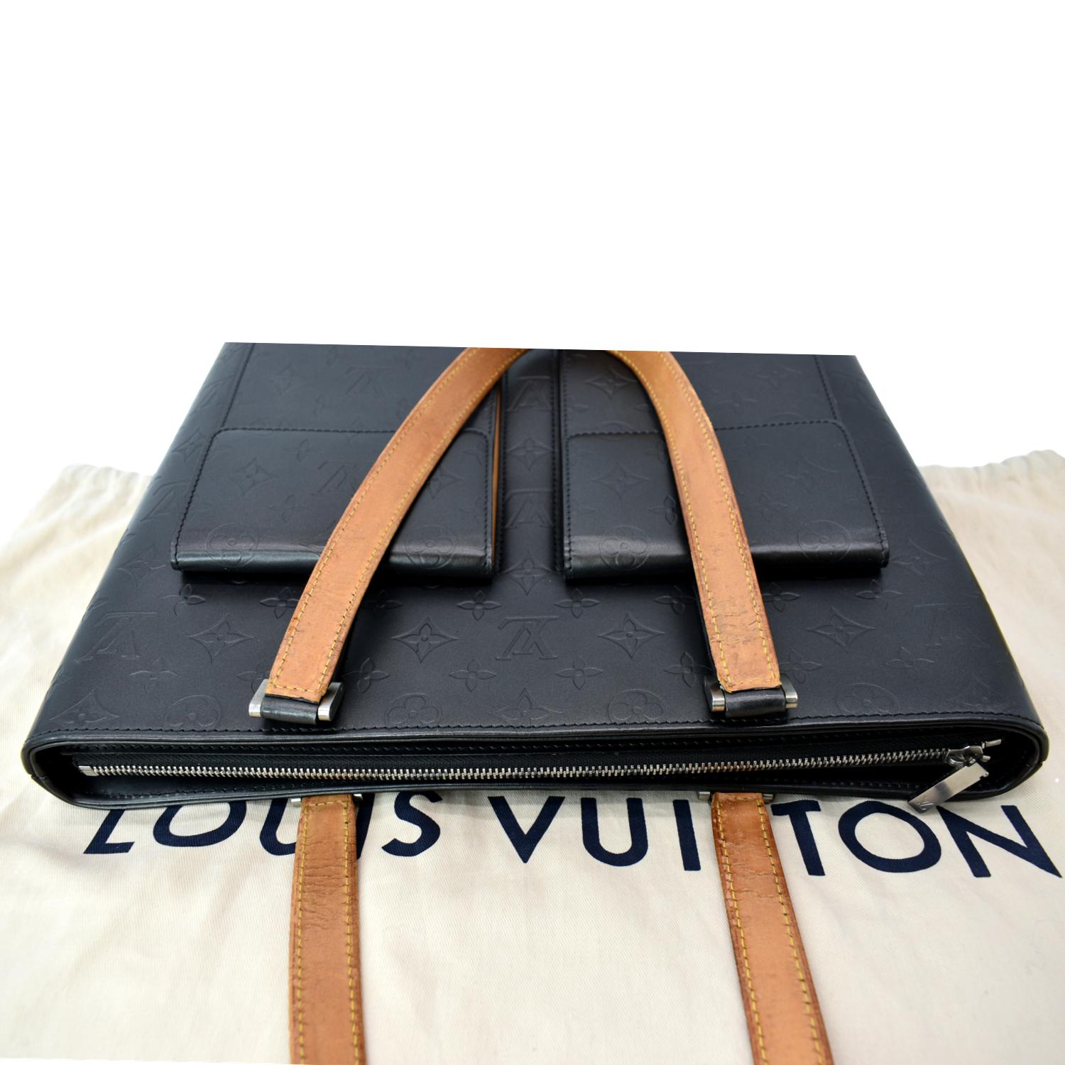 Sold at Auction: LOUIS VUITTON VINYL LOGO TOTE BAG. LEATHER TRIMME
