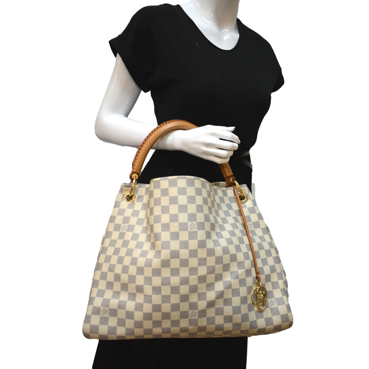 The Artsy MM features a damier azur canvas body, a rolled vachetta handle,  an open top, and interior zip and slip pockets. - Avvenice