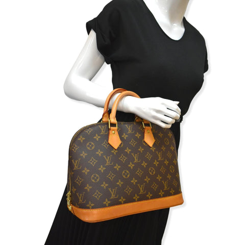 LOUIS VUITTON Alma Monogram Canvas Satchel Bag Brown