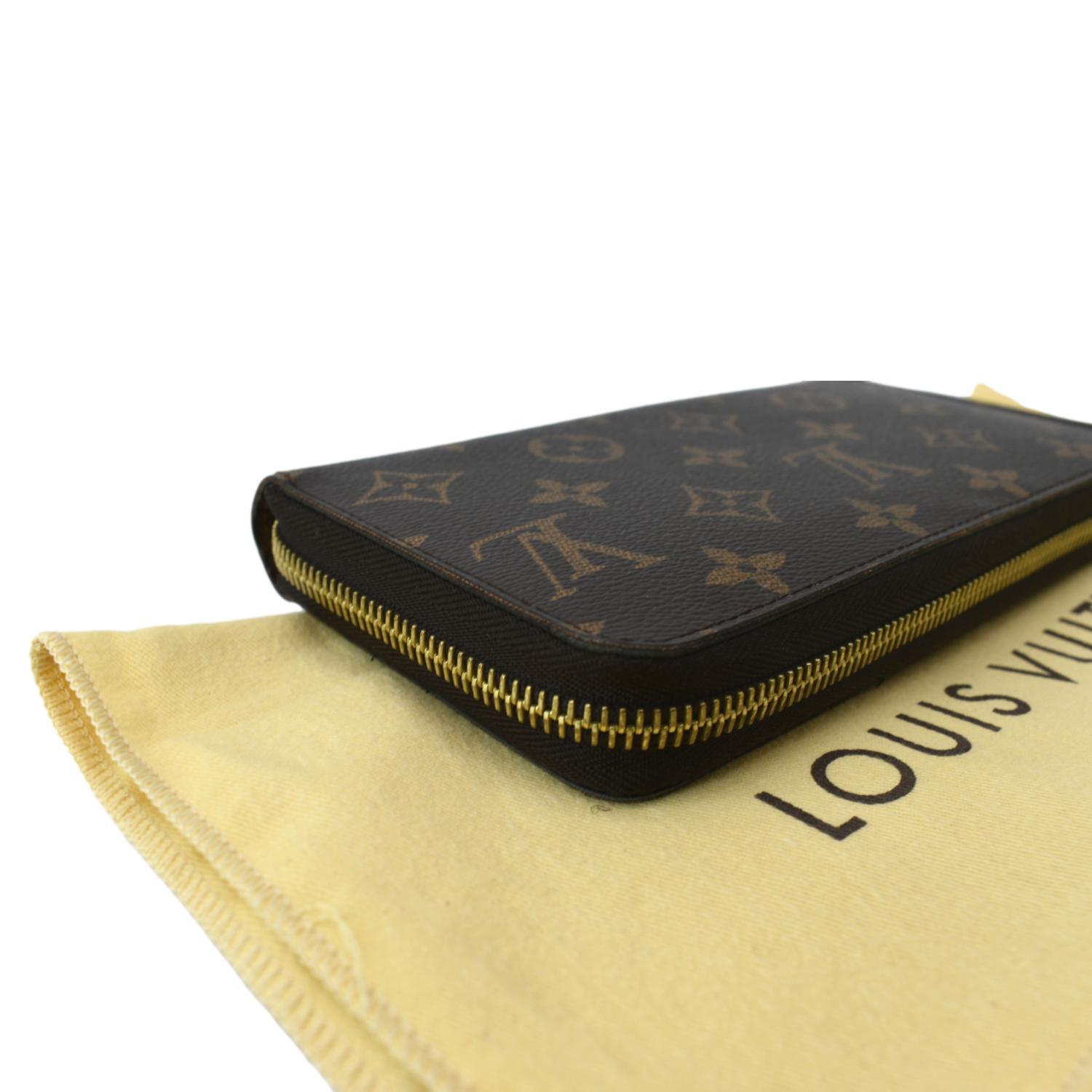 LOUIS VUITTON black leather spine brown LV monogram canvas bifold wallet at  1stDibs