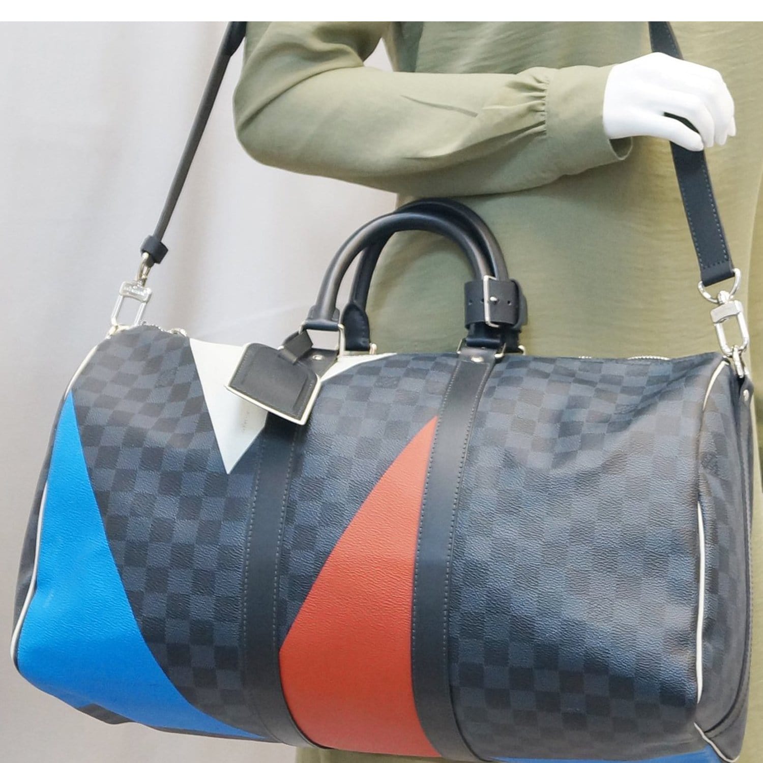 louis vuitton duffle bag with red straps