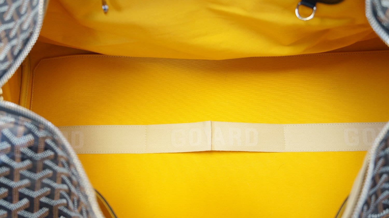 yellow goyard duffle bag