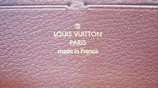 Louis Vuitton Zippy Wallet Ostrich Leather Burgundy - lv logo