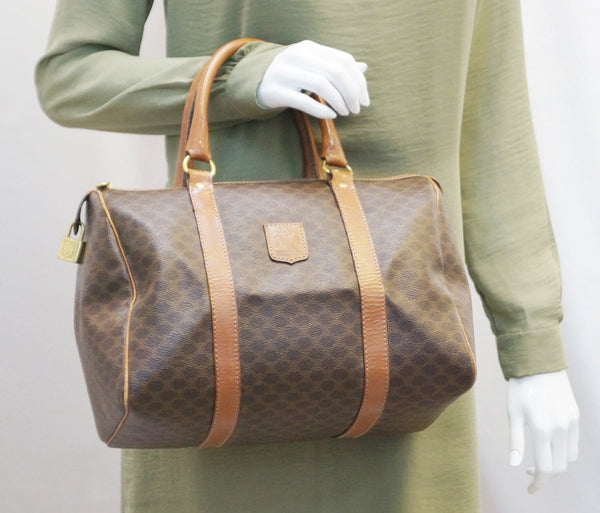 Woman holding Celine macadam pattern leather bag