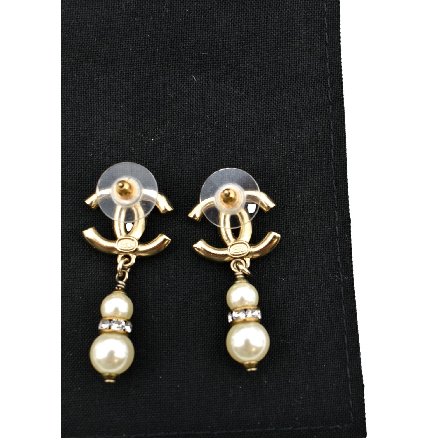 Vintage CHANEL earrings with golden CC, faux pearl, black leather