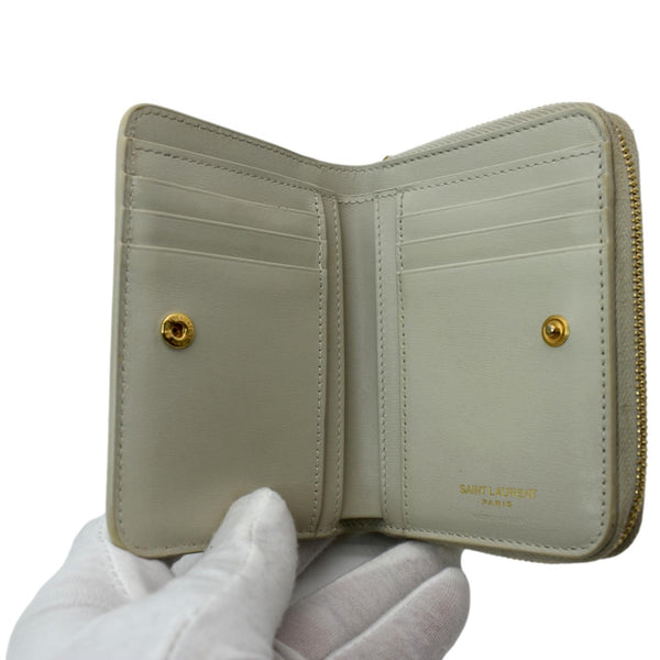 YVES SAINT LAURENT Tiny Monogram Compact Leather Zip Around Wallet White