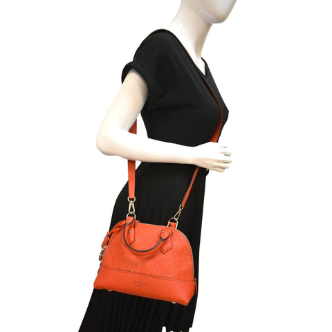 LOUIS VUITTON Neo Alma BB Monogram Empreinte Crossbody Bag Orange