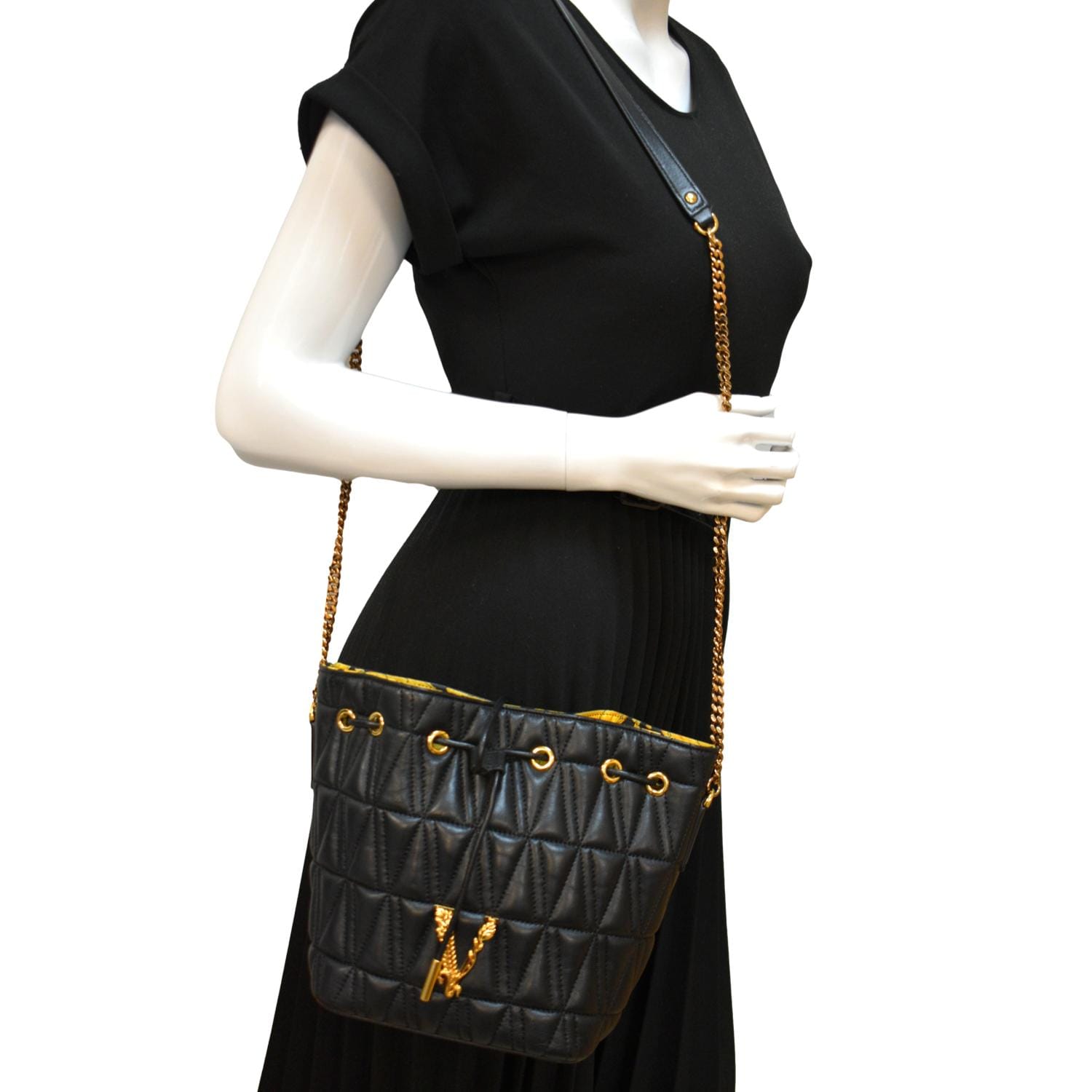 Virtus quilted leather crossbody bag in black - Versace
