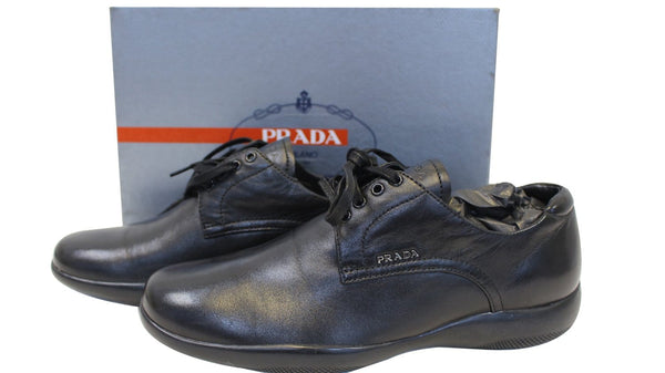 Prada Women's Sneakers - Side View Against Card