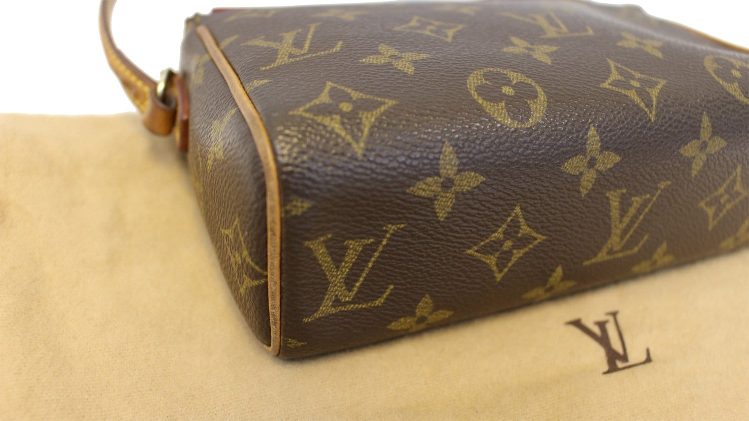 This adorable Louis Vuitton Monogram Canvas Recital Bag is an