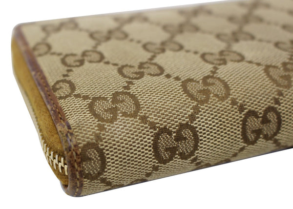 GUCCI GG Canvas Zip Around with Tassels Wallet 261393