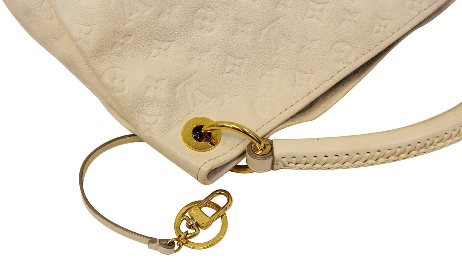 Experience the enchanting beauty of the Louis Vuitton Artsy MM Neige  Monogram Empreinte Leather Bag as you gracefully drape it over your…