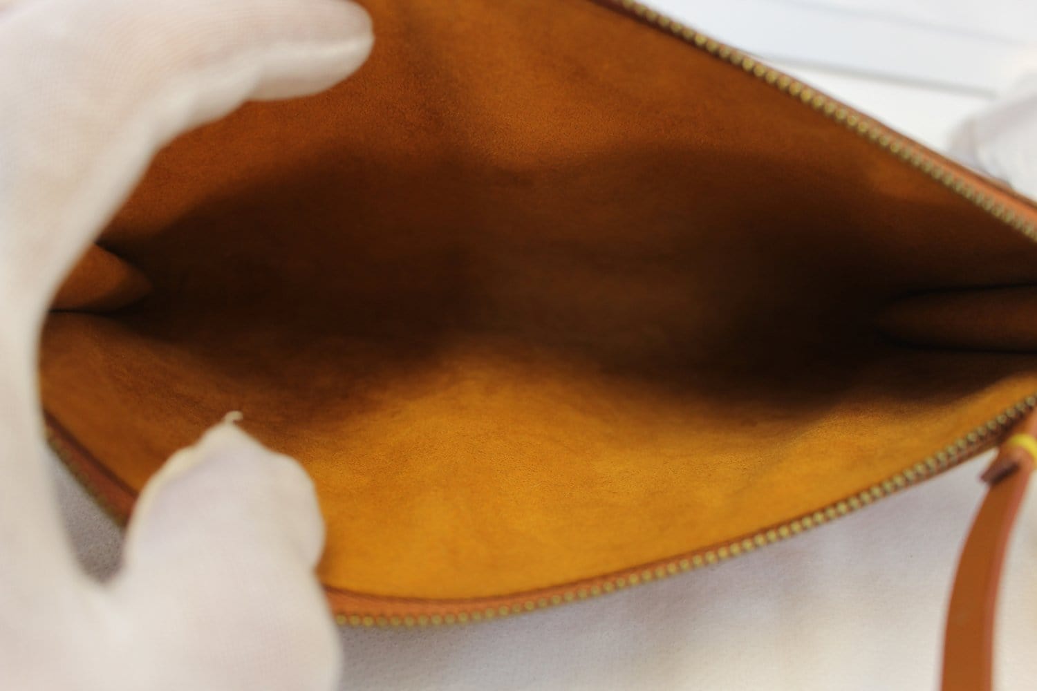 Pochette accessoire leather handbag Louis Vuitton Brown in Leather -  25110366