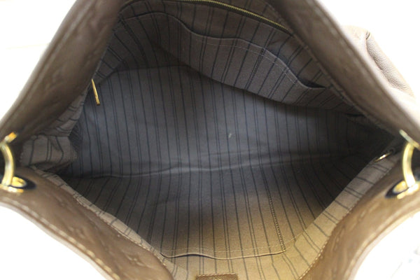 LOUIS VUITTON Terre Monogram Empreinte Leather Artsy MM Shoulder Bag