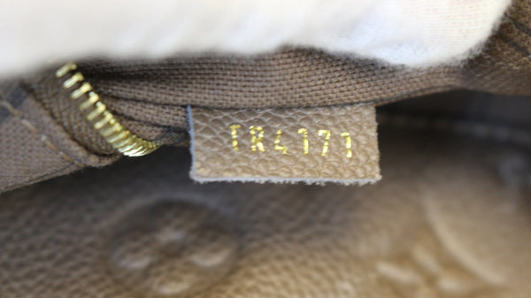 LOUIS VUITTON Terre Monogram Empreinte Leather Artsy MM Shoulder Bag